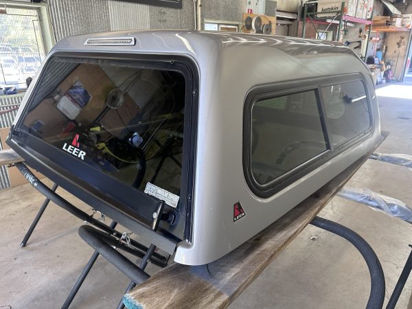7208875-scaled-1.jpg Used Silver Sky LEER 180 topper on a Toyota Tacoma Double Cab